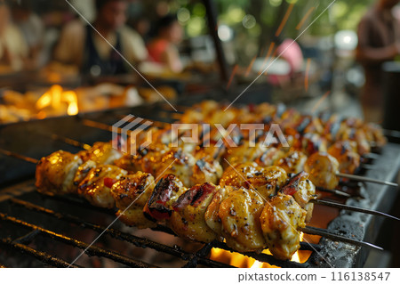 Grilled Chicken Skewers Over a Charcoal Grill 116138547