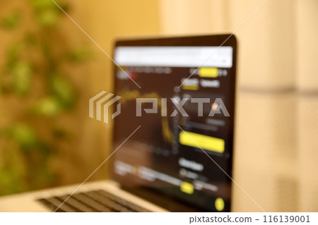 Stock exchange trading concept with blurred background. Blurred background. Laptop on trading desk with defocused graphics. Out of focus Stock exchange trading concept with blurred background. Blurred background. Laptop on trading desk with defocused graphics. Out of focus 116139001