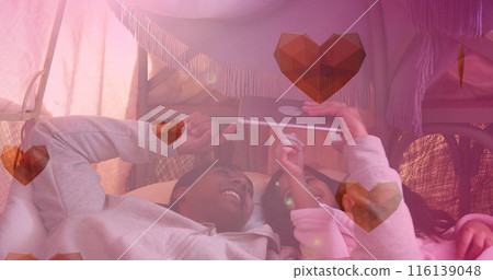 Image of heart icons over happy african american siblings using tablet Image of heart icons over happy african american siblings using tablet 116139048