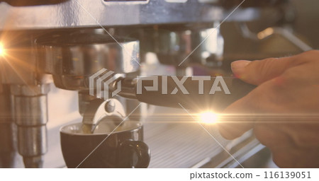 Image of glowing orange light over caucasian male barista making coffee Image of glowing orange light over caucasian male barista making coffee 116139051