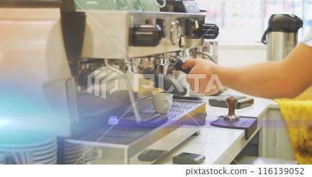 Image of glowing blue light over caucasian male barista making coffee Image of glowing blue light over caucasian male barista making coffee 116139052