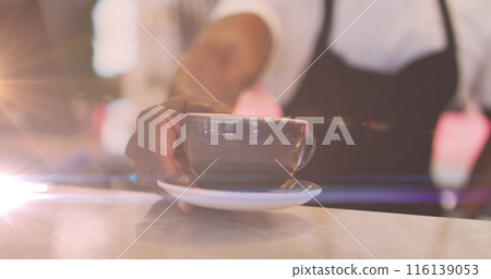 Image of glowing light over african american male barista serving coffee Image of glowing light over african american male barista serving coffee 116139053