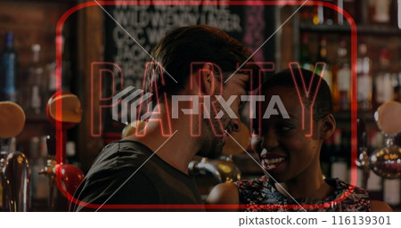 Image of neon party text in red frame over biracial couple chatting in bar 116139301