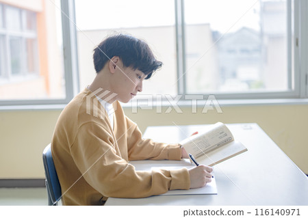 Young man studying Young man studying 116140971
