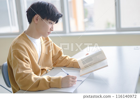 Young man studying Young man studying 116140972