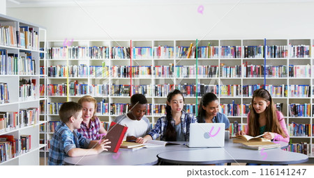 Digital composition of multiple alphabets floating against group of students studying in library 116141247