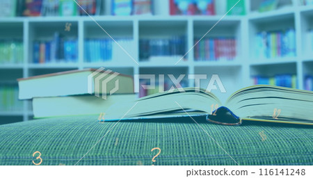 Digital composition of multiple numbers and symbols floating against stack of books in library 116141248
