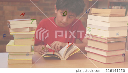 Digital composition of multiple alphabets floating against boy reading a book in library 116141250