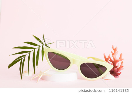 sunglasses with seashell lying on table background. Sunglasses on summer background. Top view flat lay with copy space for text sunglasses with seashell lying on table background. Sunglasses on summer background. Top view flat lay with copy space for text 116141585
