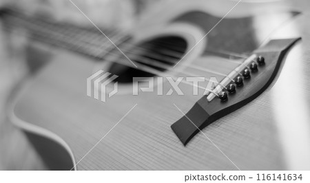 Close up of bridge wuth strings of guitar 116141634