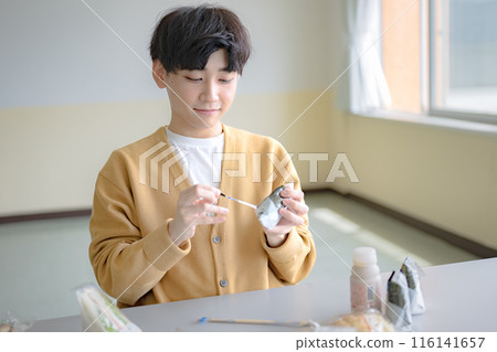 Young man with rice balls 116141657