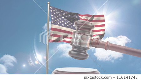 A gavel in front of American flag waving against sunny sky 116141745