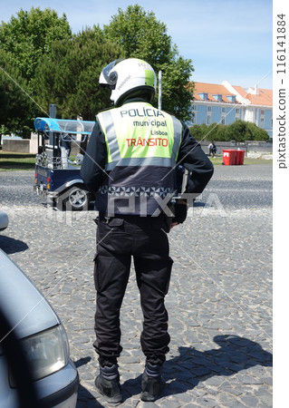 Municipal Police of Lisbon back turned officer wearing a helmet Municipal Police of Lisbon back turned officer wearing a helmet 116141884