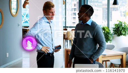 Caucasian in blue shirt chats with African American in grey sweater Caucasian in blue shirt chats with African American in grey sweater 116141970