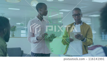 Group of African American coworkers discussing, one holding tablet 116141991