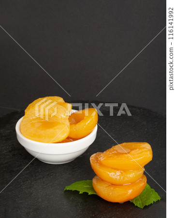 Canned Peaches, Apricot Halves in Syrup, Yellow Fruit Dessert, Tinned Nectarine Compote Canned Peaches, Apricot Halves in Syrup, Yellow Fruit Dessert, Tinned Nectarine Compote 116141992