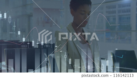 African American colleague examining financial charts on computer screen African American colleague examining financial charts on computer screen 116142113