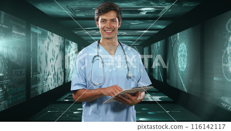 Caucasian male doctor holding tablet in high-tech room Caucasian male doctor holding tablet in high-tech room 116142117