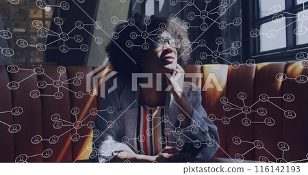 Biracial young professional sitting on sofa, thinking deeply Biracial young professional sitting on sofa, thinking deeply 116142193