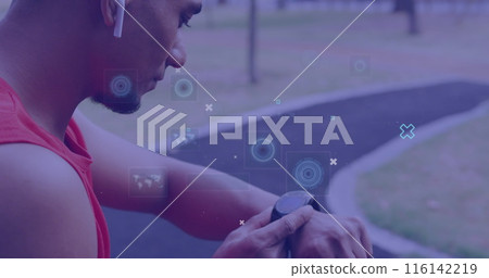 Biracial man checking smartwatch during outdoor workout Biracial man checking smartwatch during outdoor workout 116142219