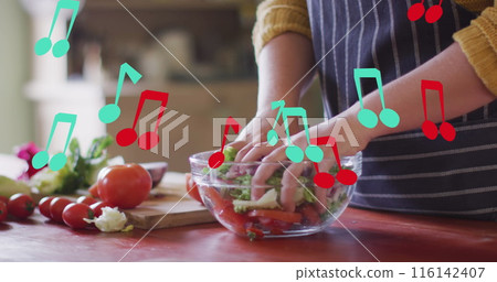 Image of notes over caucasian woman mixing vegetables 116142407