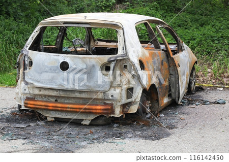 Burnt out car in France Burnt out car in France 116142450