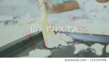 Biracial girl playing with dough, letters floating around Biracial girl playing with dough, letters floating around 116142496