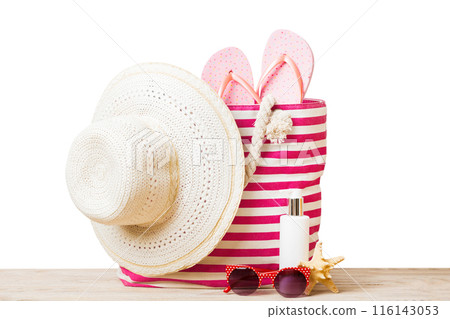 Stylish bag with beach accessories . Summer holiday concept. Top view of beach bag with sunscreen cream with space for text Stylish bag with beach accessories . Summer holiday concept. Top view of beach bag with sunscreen cream with space for text 116143053