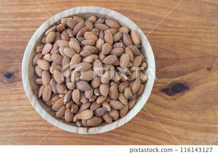 Almond kernel in a bowl. Background view from above. Healthy food. 116143127