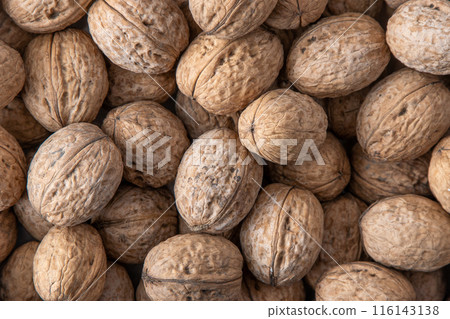 Walnut in shell. Background view from above. Healthy food top view. Walnut in shell. Background view from above. Healthy food top view. 116143138