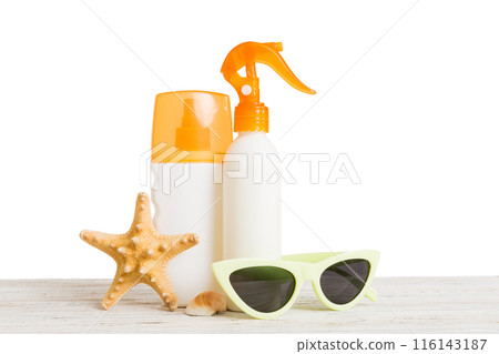 Professional Summer face skincare. Unbranded flacon with moisturizing liquid. Cream or lotion. Summer decorations, seashell and starfish, on table with isolated background. Beauty concept Perspective Professional Summer face skincare. Unbranded flacon with moisturizing liquid. Cream or lotion. Summer decorations, seashell and starfish, on table with isolated background. Beauty concept Perspective 116143187