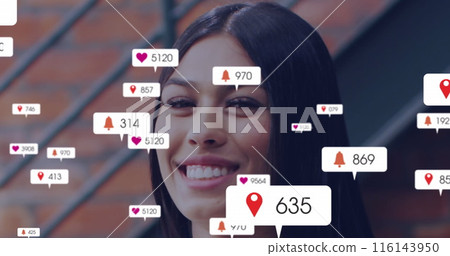Image of changing numbers, icons in notification bars, portrait of smiling biracial woman 116143950