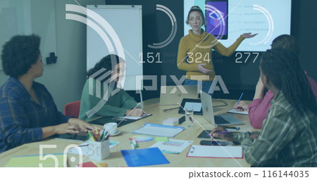 Image of stock market data processing over caucasian woman discussing with colleagues at office 116144035