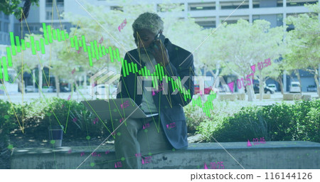 Image of graphs, changing numbers, african american man talking on cellphone and using laptop 116144126