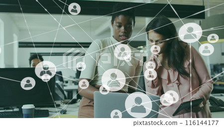 Image of connected icons over diverse female coworkers analyzing reports on laptop 116144177