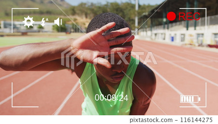 Image of digital interface with recording screen and african american athlete wiping forehead Image of digital interface with recording screen and african american athlete wiping forehead 116144275