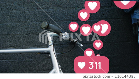 Image of social media heart icons over woman using smartphone and drinking coffee 116144385