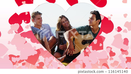 Image of hearts over happy caucasian friends with guitar on beach Image of hearts over happy caucasian friends with guitar on beach 116145140