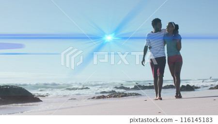 Image of light trails over african american couple at beach Image of light trails over african american couple at beach 116145183