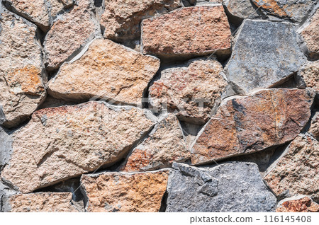 texture of the masonry of modern stone wall made of stones in closeup texture of the masonry of modern stone wall made of stones in closeup 116145408