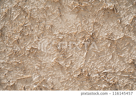 texture of old traditional Asian clay wall with straw close-up texture of old traditional Asian clay wall with straw close-up 116145457