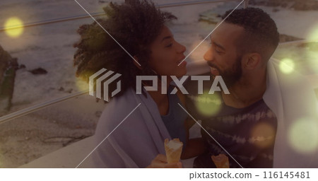 Image of spots over diverse couple kissing 116145481