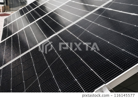 cells of black solar panel in closeup. Renewable green Energy system cells of black solar panel in closeup. Renewable green Energy system 116145577