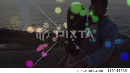 Image of spots over diverse couple embracing Image of spots over diverse couple embracing 116145589