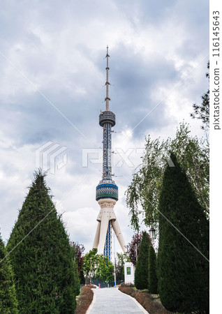 landmark television TV tower in Tashkent in Uzbekistan against the background of a park in spring under cloudy sky 116145643
