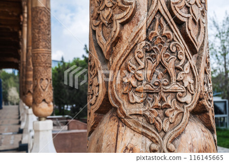 carved wooden column in colonnade with arabic pattern Uzbek ornament in Museum of Victims of Political Repression in Tashkent in Uzbekistan 116145665