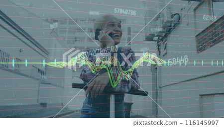 Image of graphs, changing numbers, bald biracial woman standing on scooter and talking on phone 116145997