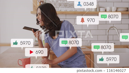 Image of notification bars over caucasian woman talking on speaker of cellphone at home Image of notification bars over caucasian woman talking on speaker of cellphone at home 116146027