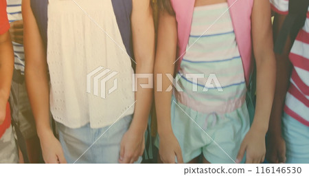 School children wearing colorful clothes, holding hands 116146530