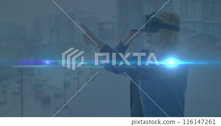 Image of light spots over caucasian woman with vr headset 116147261
